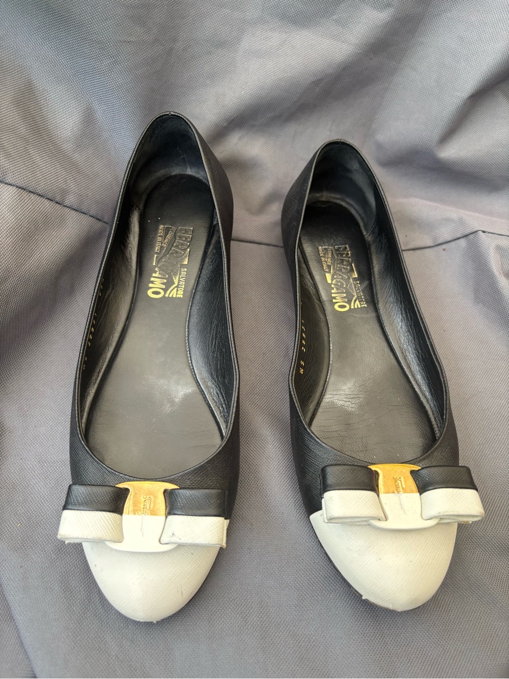 Salvatore Ferragamo Black Leather Flats with Cream Cap Toe and Bow